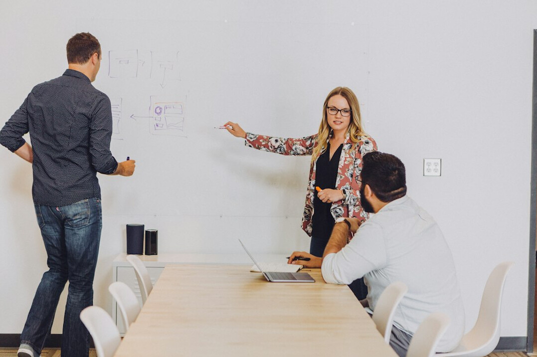 corporate programmers in meeting