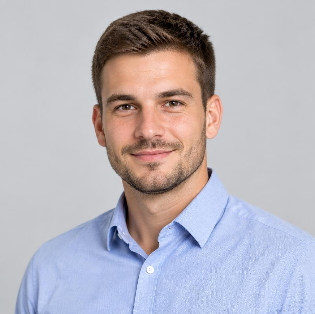 Studio portrait of a Croatian man in his 30s wearing business casual clothing